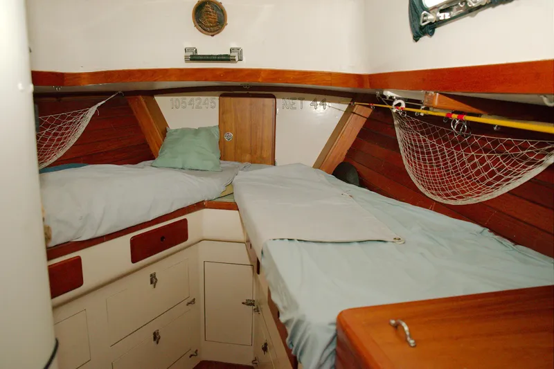 Slide: The Image of Interior of 1997 Crealock custom schooner with twin beds and wooden cabinetry. - 10