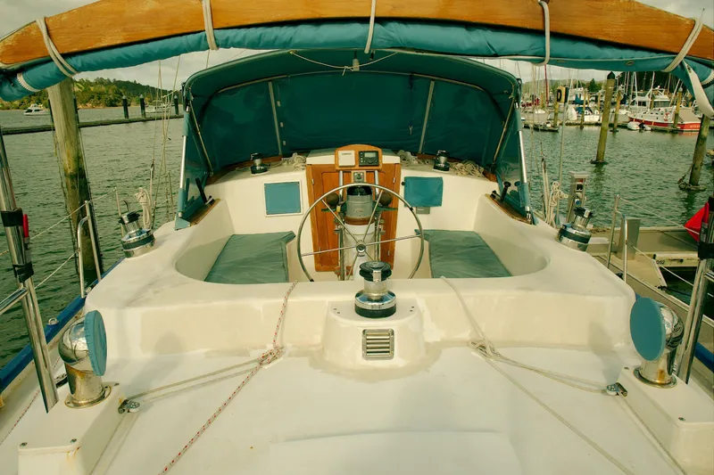 Slide: The Image of Cockpit of 1997 Crealock custom-built raised cabintop schooner, docked at marina. - 12
