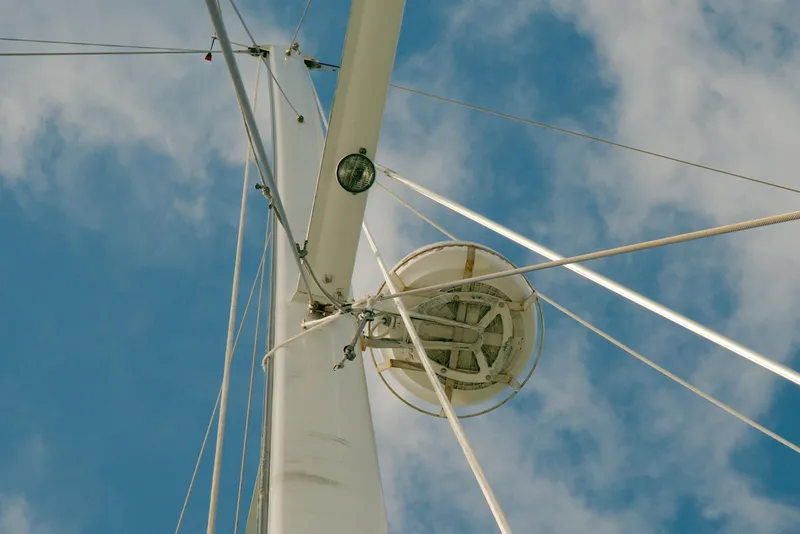 Slide: The Image of Mast and rigging of 1997 Crealock custom schooner against blue sky. - 15
