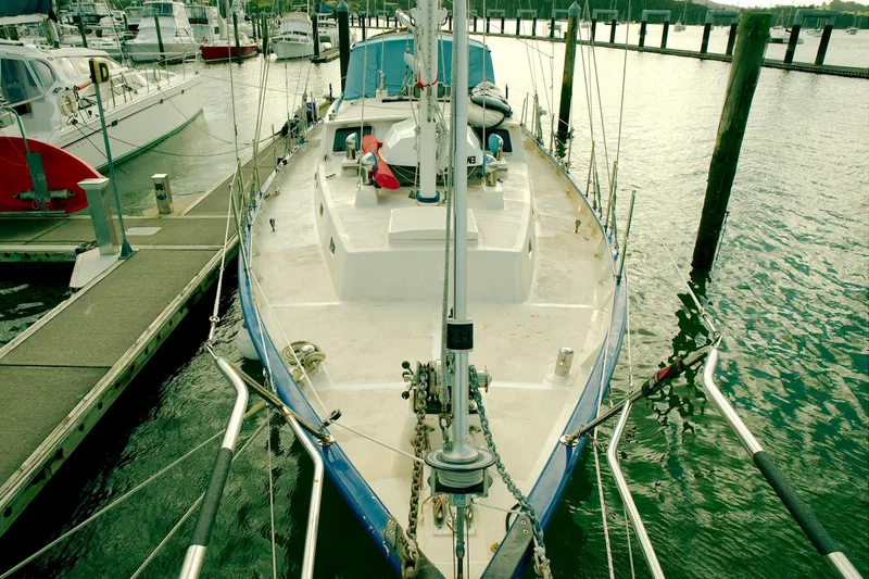 Slide: The Image of Crealock 1997 custom-built raised cabintop schooner docked at marina. - 19