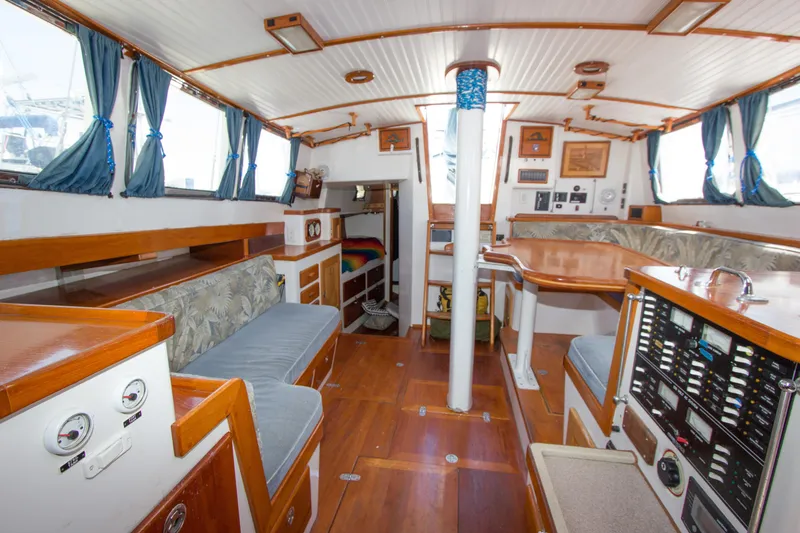 Slide: The Image of Cozy cabin interior of 1997 Crealock custom schooner with colorful bedding and warm lighting. - 29