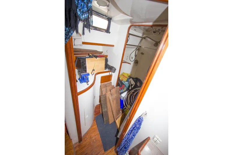 Slide: The Image of Interior of 1997 Crealock custom schooner with woodwork and storage area. - 31