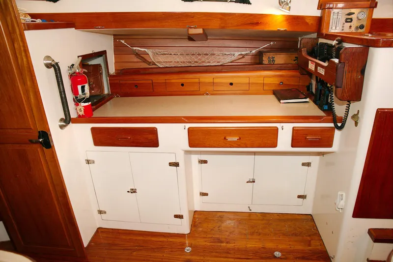 Slide: The Image of Crealock 1997 custom-built raised cabintop schooner docked at marina. - 39