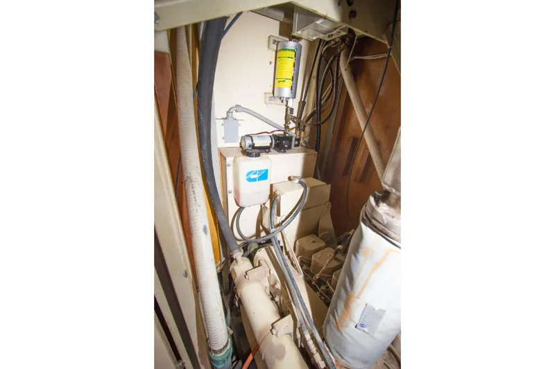 Slide: The Image of Engine room of 1997 Crealock custom-built raised cabintop schooner, showcasing mechanical components. - 41