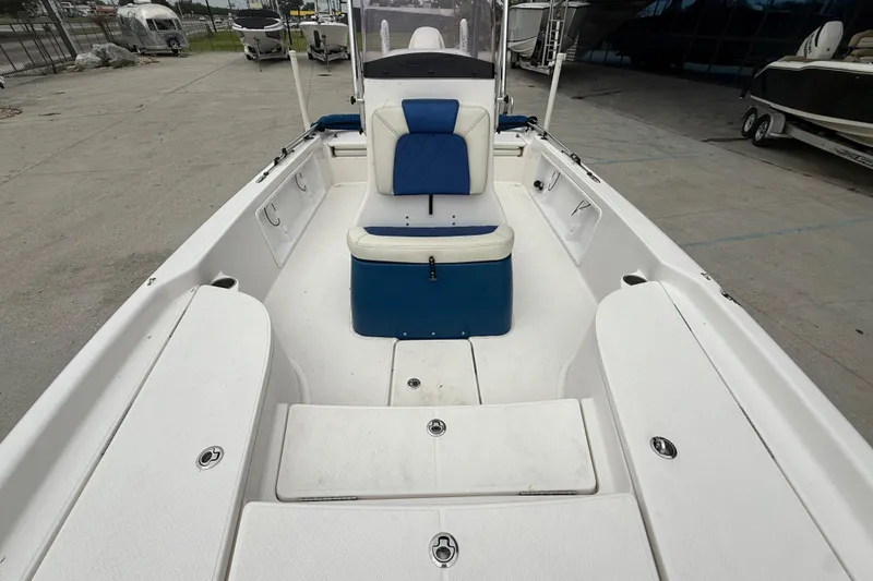Slide: The Image of 2019 Blue Wave 2200 PureBay boat interior with blue and white seating. - 10