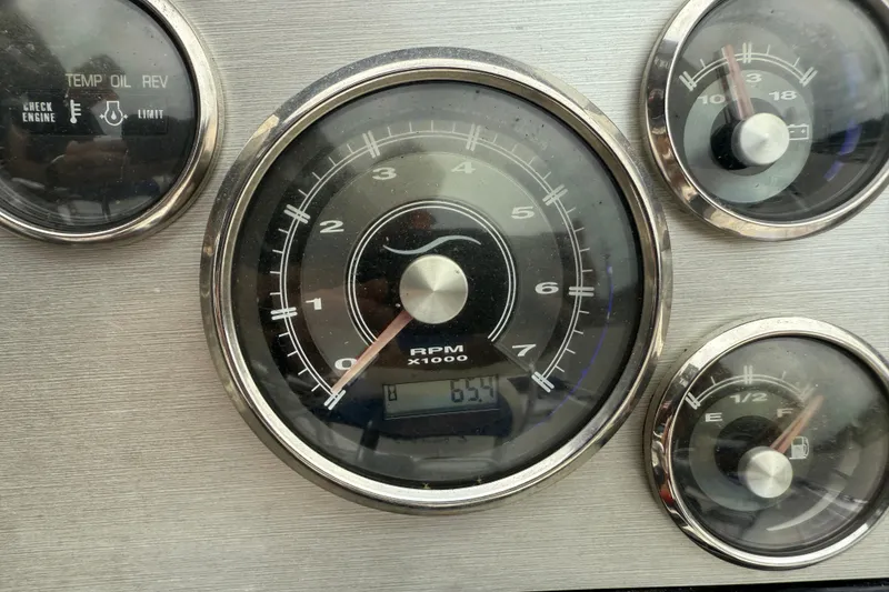 Slide: The Image of Dashboard gauges of a 2019 Blue Wave 2200 PureBay boat, showing RPM and fuel levels. - 15