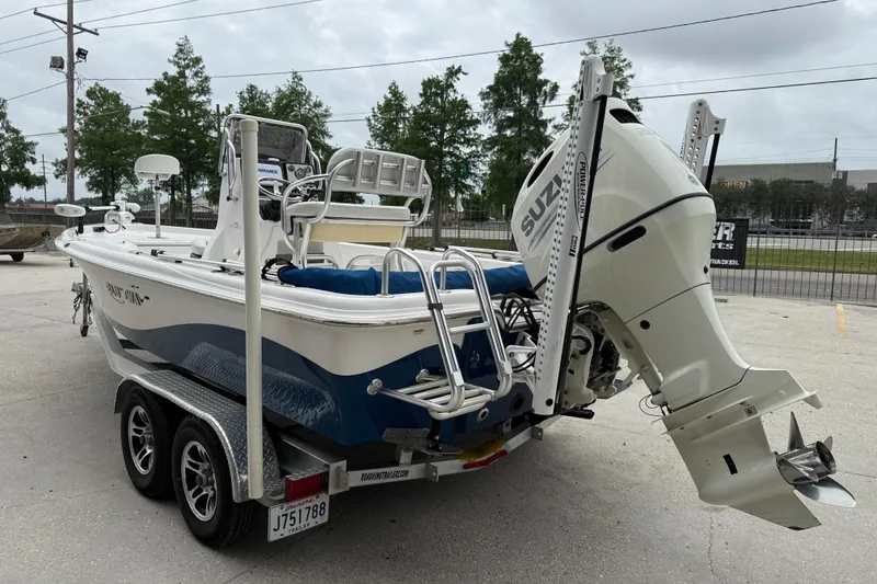Slide: The Image of 2019 Blue Wave 2200 PureBay boat with Suzuki outboard motor on trailer. - 4