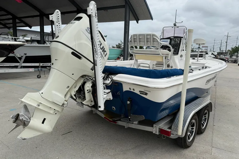 Slide: The Image of 2019 Blue Wave 2200 PureBay boat with Suzuki outboard motor on trailer. - 6