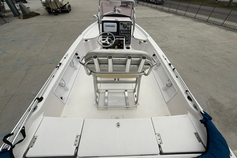 Slide: The Image of 2019 Blue Wave 2200 PureBay boat interior with steering console and seating. - 7