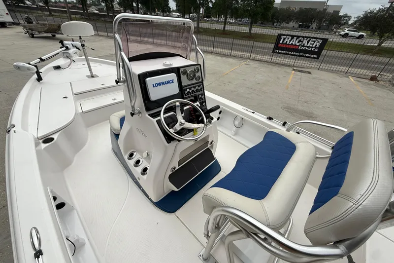 Slide: The Image of 2019 Blue Wave 2200 PureBay boat interior with steering console and seating. - 8