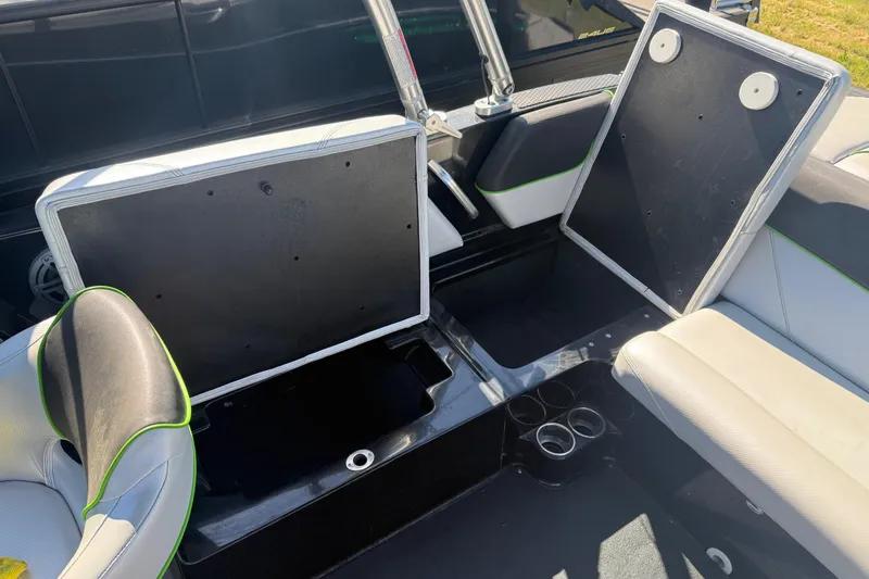 Slide: The Image of 2016 MasterCraft NXT22 boat interior with open storage compartments and seating. - 10