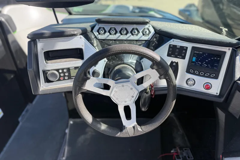 Slide: The Image of 2016 MasterCraft NXT22 dashboard with steering wheel and control panel. - 15