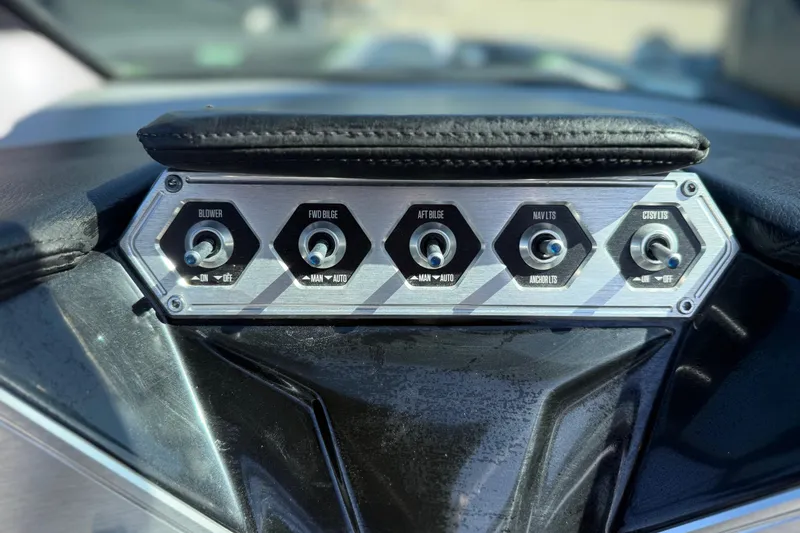 Slide: The Image of Control panel of a 2016 MasterCraft NXT22 boat with toggle switches. - 17