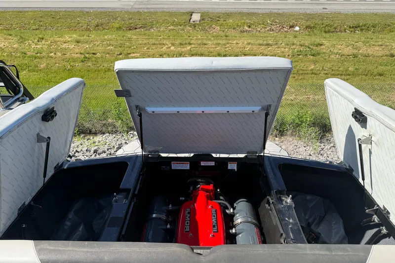 Slide: The Image of Open engine compartment of a 2016 MasterCraft NXT22 boat, showcasing the Ilmor engine. - 22