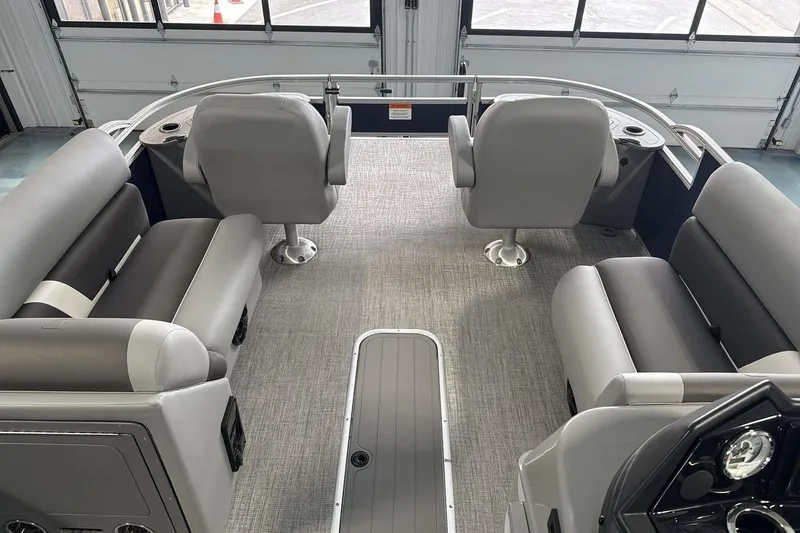 Slide: The Image of Interior of 2026 Landau Island Breeze 23F pontoon boat with gray seating and carpet. - 10