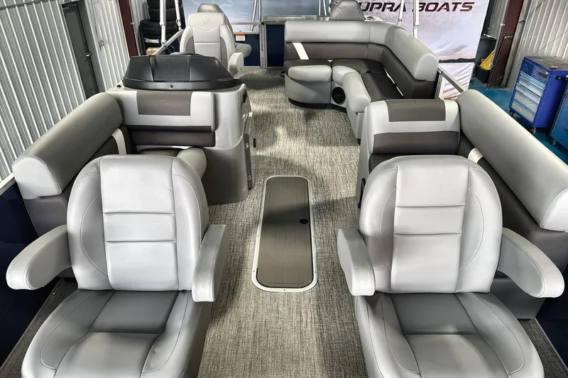 Slide: The Image of Luxurious interior of 2026 Landau Island Breeze 23F pontoon boat with plush seating. - 11