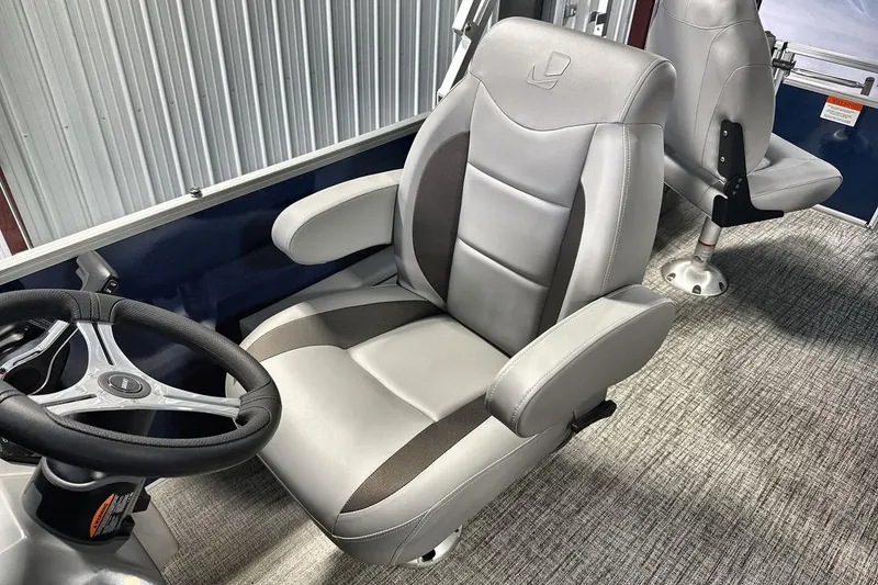Slide: The Image of Captain's chair in 2026 Landau Island Breeze 23F pontoon boat, featuring sleek design and comfort. - 13