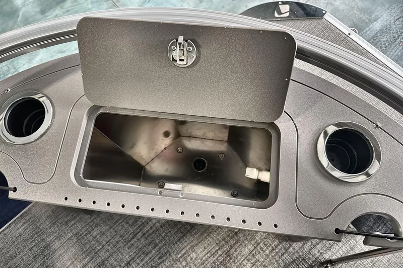 Slide: The Image of 2026 Landau Island Breeze 23F boat console with storage compartment and cup holders. - 19