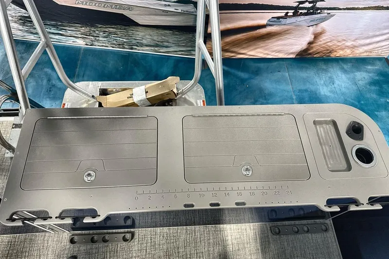Slide: The Image of Fishing station on 2026 Landau Island Breeze 23F pontoon boat with storage and cup holders. - 24