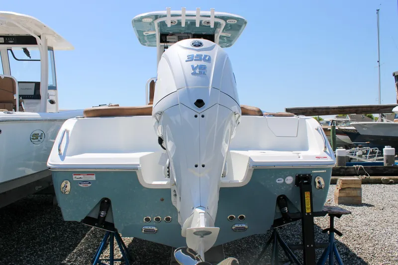 The Image of 2026 Sea Hunt Ultra 255 SE boat with powerful 350 V8 engine, displayed outdoors. - 0
