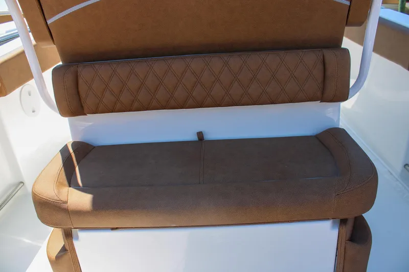 Slide: The Image of Brown cushioned seating on 2026 Sea Hunt Ultra 255 SE boat. - 13