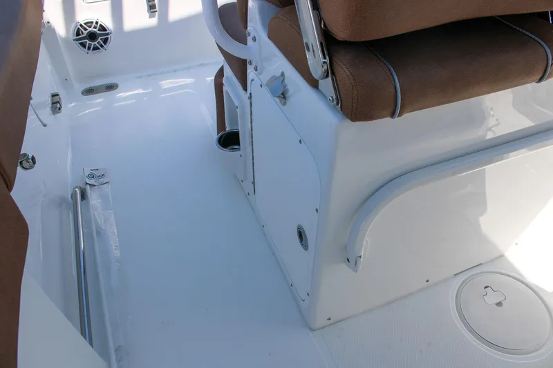 Slide: The Image of Interior view of 2026 Sea Hunt Ultra 255 SE boat with brown seating. - 15