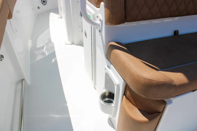 Slide: The Image of Luxurious seating on 2026 Sea Hunt Ultra 255 SE boat with cup holder. - 17