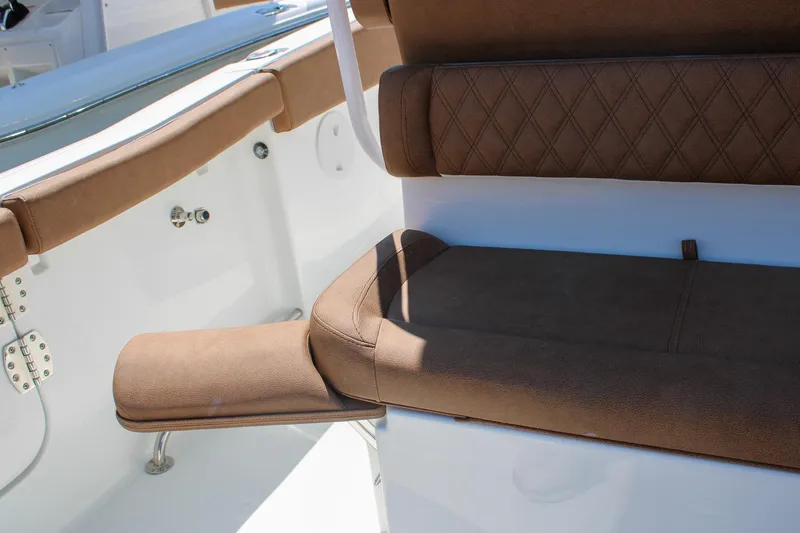 Slide: The Image of Luxurious seating on 2026 Sea Hunt Ultra 255 SE boat, featuring brown upholstery. - 18