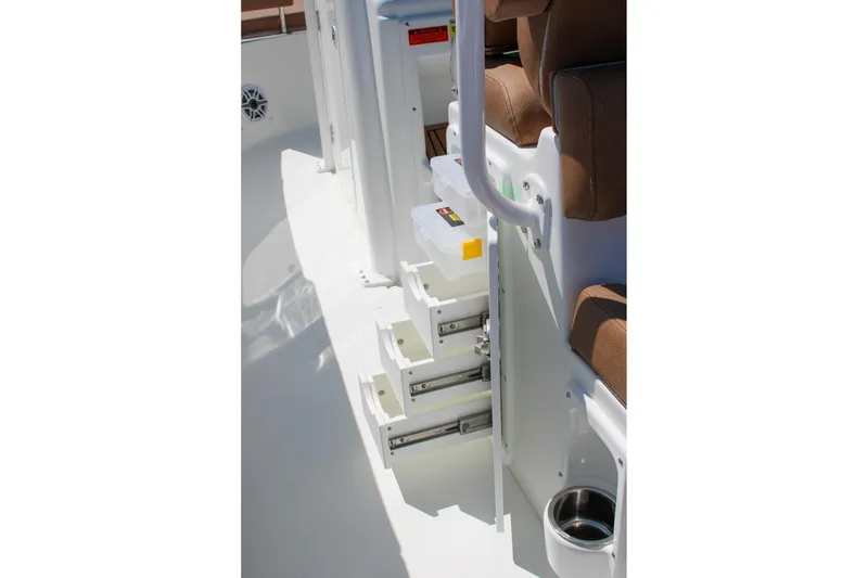 Slide: The Image of Interior view of 2026 Sea Hunt Ultra 255 SE boat, featuring storage compartments and seating. - 21