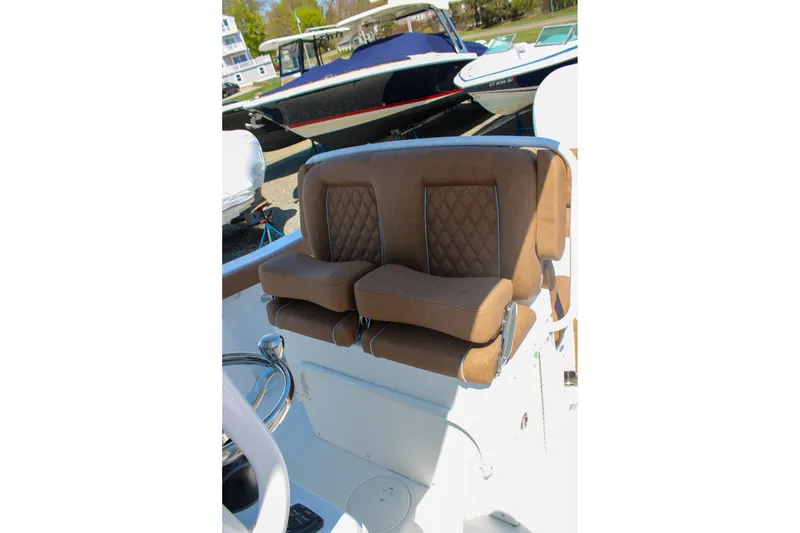 Slide: The Image of Luxurious brown seating on 2026 Sea Hunt Ultra 255 SE boat, showcasing comfort and style. - 24