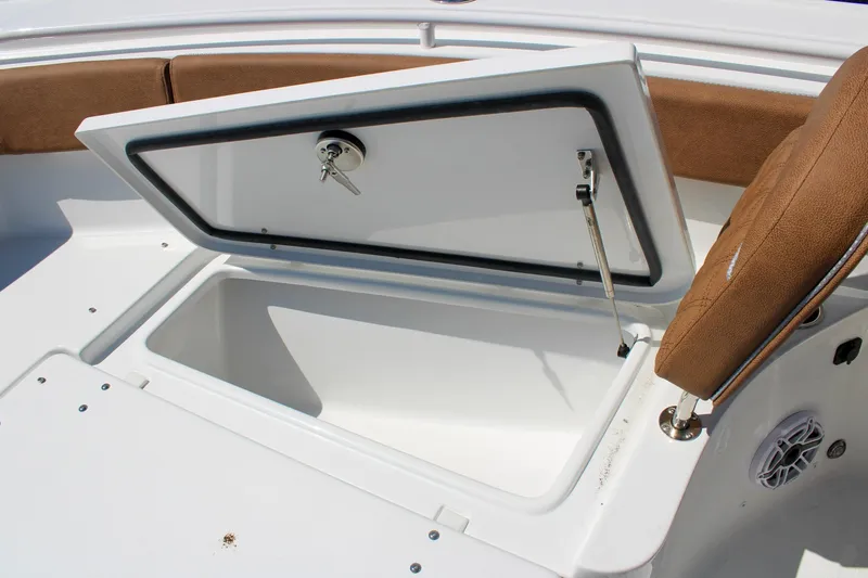 Slide: The Image of Open storage compartment on 2026 Sea Hunt Ultra 255 SE boat. - 31