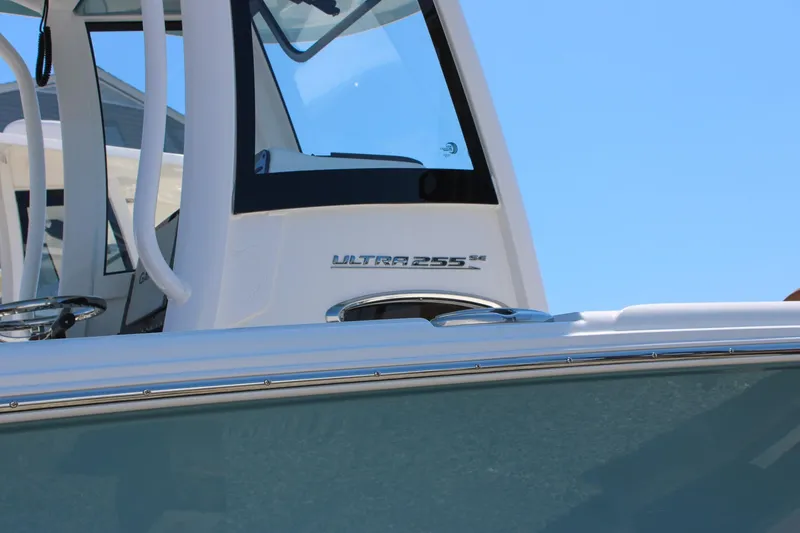 Slide: The Image of 2026 Sea Hunt Ultra 255 SE boat, close-up of the helm and branding. - 39