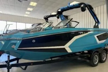 The Image of 2026 Heyday WT-2DC boat in showroom, featuring sleek blue design and modern wakeboard towers. - 0