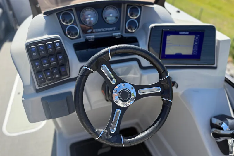 Slide: The Image of Steering console of 2023 Starcraft SLS 5 boat with navigation display and controls. - 11