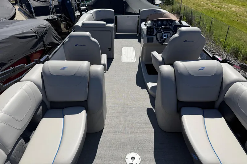 Slide: The Image of 2023 Starcraft SLS 5 boat interior with luxurious seating and modern dashboard. - 16