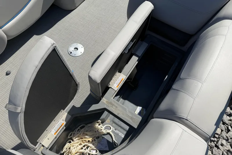 Slide: The Image of 2023 Starcraft SLS 5 boat interior storage compartment with rope, open seating. - 17