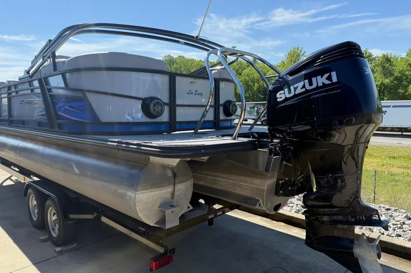 Slide: The Image of 2023 Starcraft SLS 5 pontoon boat with Suzuki outboard motor on trailer. - 20