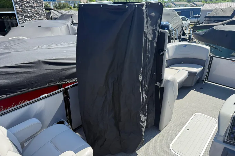 Slide: The Image of 2023 Starcraft SLS 5 boat interior with covered seating area and modern design. - 7