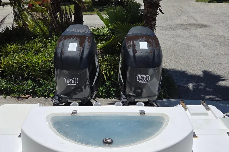 Slide: The Image of Twin Suzuki 150 outboard motors on a 2009 Sea Fox 256 Walk Around boat. - 4