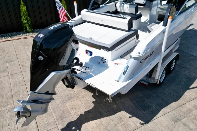 Slide: The Image of 2023 Cobalt R4 Outboard boat with powerful engine on a trailer. - 12