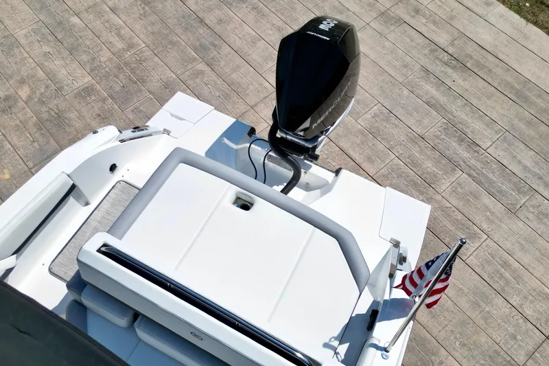 Slide: The Image of 2023 Cobalt R4 Outboard boat with Mercury engine and American flag on deck. - 5