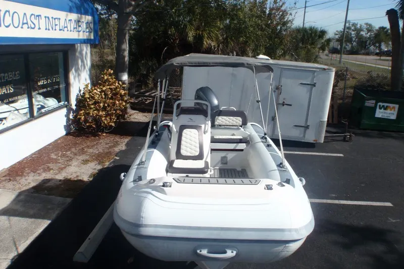 Slide: The Image of 2021 Highfield Sport 460 inflatable boat parked outside a store. - 3
