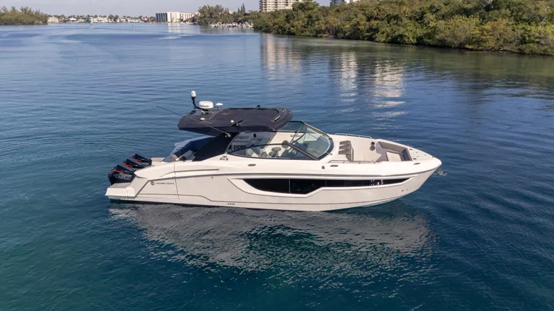 Slide: The Image of 2021 Cruisers Yachts 38 GLS OB 450R on calm water, side view. - 2