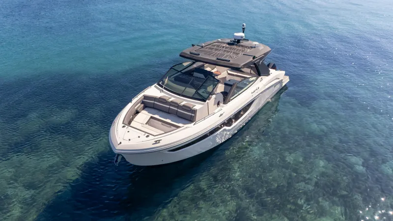 Slide: The Image of 2021 Cruisers Yachts 38 GLS OB 450R on clear blue water. - 6