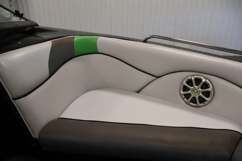 Slide: The Image of 2011 Moomba Mobius LSV boat interior with stylish seating and speaker detail. - 12