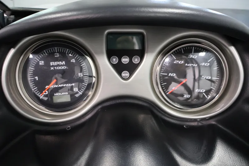 Slide: The Image of Dashboard of a 2011 Moomba Mobius LSV showing RPM and MPH gauges. - 17