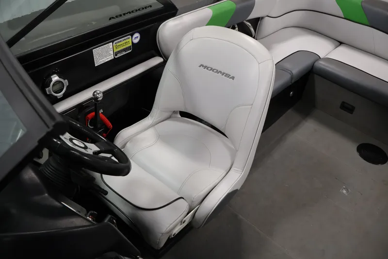 Slide: The Image of 2011 Moomba Mobius LSV interior with white seating and steering wheel. - 28
