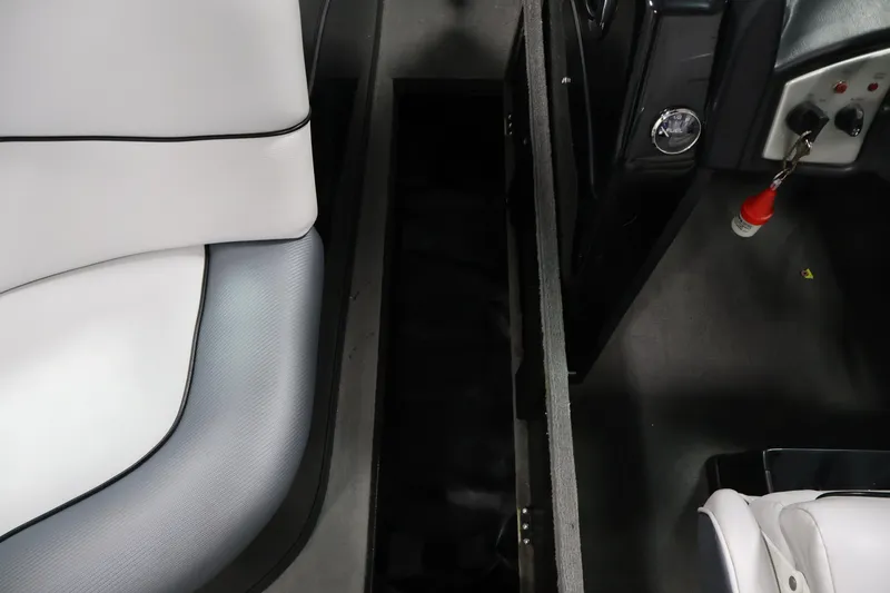 Slide: The Image of Interior of a 2011 Moomba Mobius LSV boat showing seating and control panel. - 31