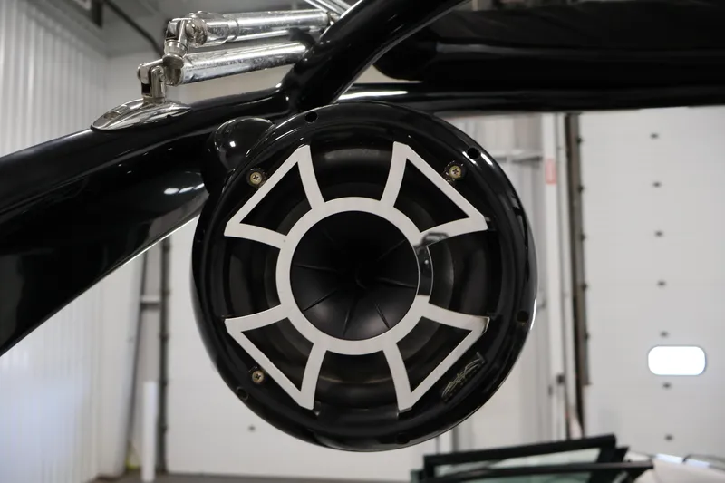 Slide: The Image of Close-up of a 2011 Moomba Mobius LSV boat speaker in a garage setting. - 42