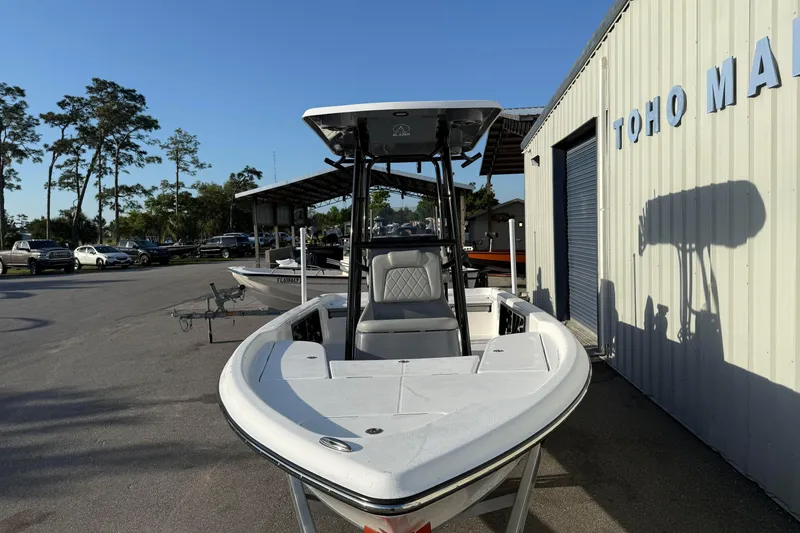 Slide: The Image of 2026 Blazer Bay PURE BAY 2200 boat at marina, front view with clear sky. - 10